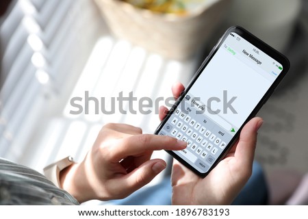 Woman sending message with text I Love You, closeup