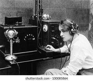 Woman Sending Morse Code Using Telegraph