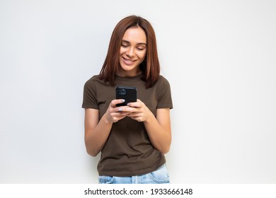 Woman Sending A Sms On Cell Phone, Isolated On White Background