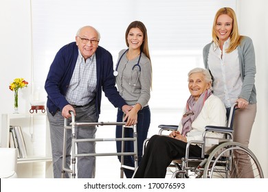 Woman with senior couple at home getting help from a caregiver - Powered by Shutterstock