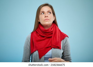 Woman Serious Looking Up. Isolated Studio Portrait. Red Winter Scarf.