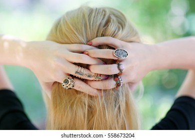 Woman Setting Hair. Beautiful Rings On Female Hands