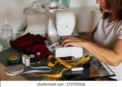 Woman Sewing Cloth Face Mask For Family