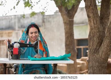 Woman sewing clothes with sewing machine