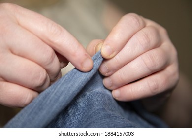 Woman Sewing Denim Blue Jeans With Blue Thread