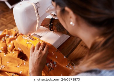 Woman, sewing machine and textile production in studio or manufacturing clothes, small business or fabric. Female person, tailor and creative entrepreneur in workshop for fashion, pattern or handmade - Powered by Shutterstock