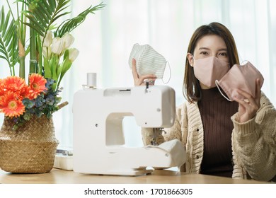 Woman Sewing Medical Masks At Home. Sewing On A Sewing Machine