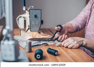 Woman Sewing Medical Masks On Sewing Machine During Coronavirus Pandemic, Protection Against Covid-2019, Homemade Sewing