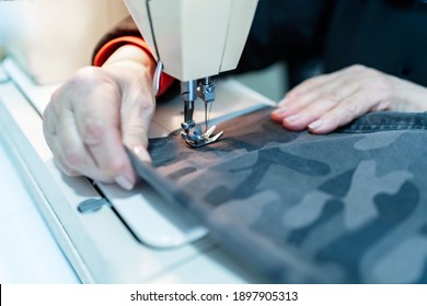 Woman Sewing Pants With Her Sewing Machine