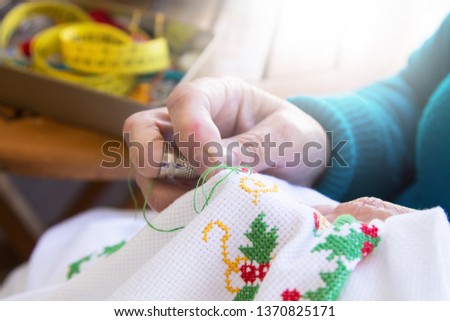 woman sewing sitting at home