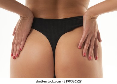 A Woman With A Sexy Back, A Narrow Big Ass In Underwear. Beautiful Female Body In Shape. Closeup Healthy Girl With Toned Slim Body, Soft Skin And Elastic Buttocks, Thighs In Black Bikini Panties.