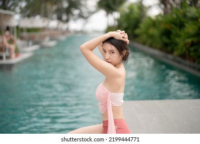 Woman In Sexy Bikini At Poolside Outdoor.