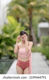 Woman In Sexy Bikini At Poolside Outdoor.