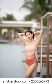 Woman In Sexy Bikini At Poolside Outdoor.