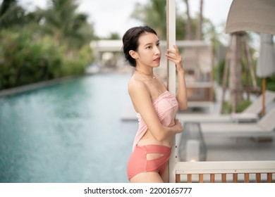 Woman In Sexy Bikini At Poolside Outdoor.