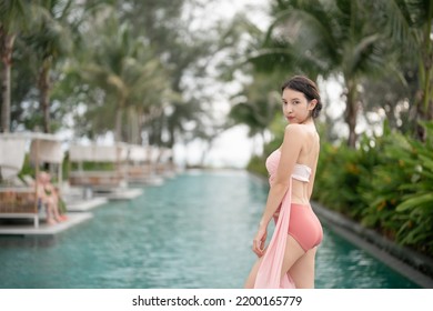 Woman In Sexy Bikini At Poolside Outdoor.