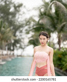 Woman In Sexy Bikini At Poolside Outdoor.