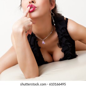 Woman With Sexy Cleavage And Red Lips