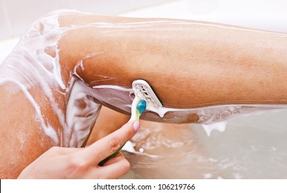 Woman Shaving Her Legs