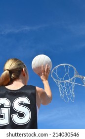 Woman Shoots A Netball Goal