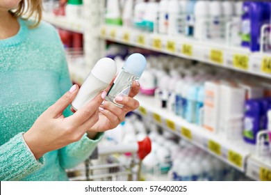 Woman in shop chooses deodorant closeup