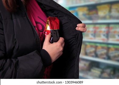 Woman Shoplifting In A Store