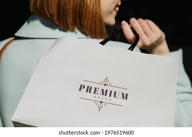 Woman with a shopping bag after a spending spree