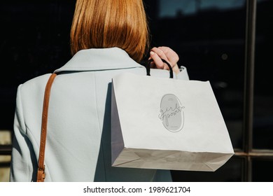 Woman With A Shopping Bag After A Spending Spree