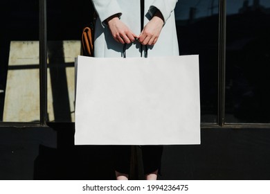 Woman With A Shopping Bag After A Spending Spree