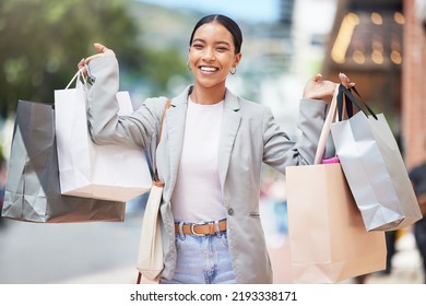 Woman shopping, fashion and retail gift bags for customer buying stylish clothes and spending money on a city spree. Portrait smile, happy and fun lady with cool, trendy and sales presents from - Shutterstock ID 2193338171