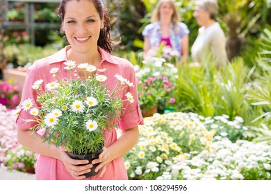 Woman Shopping At Flower Shop Green House Garden Centre