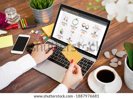 Woman shopping for hand made jewelry online