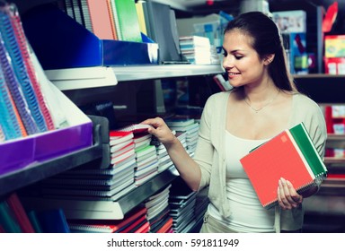 ï»¿smiling Woman Shopping Notebooks And Writing Paper In Stationary Store