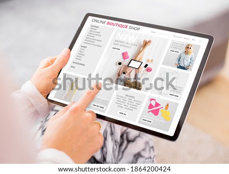 Woman shopping online at boutique fashion store