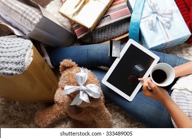 Woman shopping online with a credit card