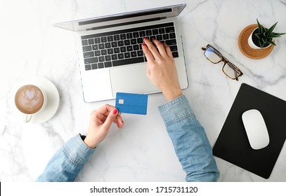 Woman Shopping Online And Pay With The Blue Credit Card. Flat Lay And Modern Style.