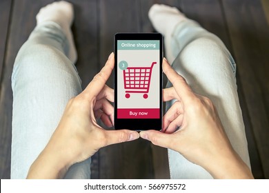 A Woman Is Shopping At The Online Store. Shopping Cart Icon. Ecommerce