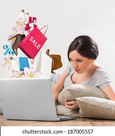 Woman Shopping Online Using Her Laptop At Home