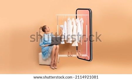 Woman Shopping Online Using Laptop Sitting Near Big Smartphone Choosing Clothes On Rail Over Beige Studio Background. Ecommerce, Fashion And Technology. Collage, Panorama