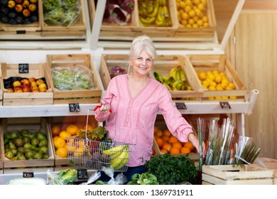 Woman Shopping In Small Grocery Store