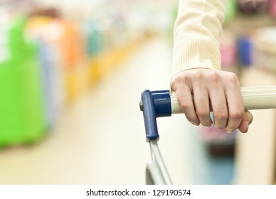 Woman Shopping In Super Market And Pushing Cart Hand Closeup