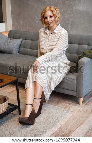 Similar – Woman in work wear in her workshop by table with handmade items