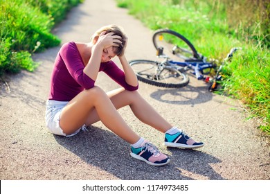 Woman With Short Hair With Head Injury After Biking On Bicycle. Sport, Healthcare And People Concept