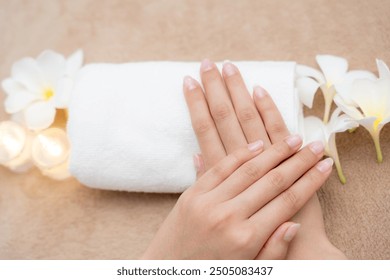 Woman show beautiful nail after receive care service by professional Beautician Manicure at spa centre. Nail beauty salon use nail file for Glazing treatment. manicurist make nail to beautiful.
