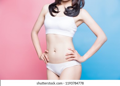 Woman Show Her Thin Waist With Blue And Pink Background