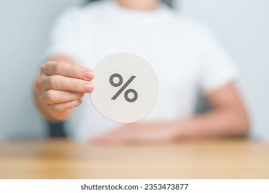 Woman show percentage symbol paper. Interest rate, financial, ranking, discount and promotion and mortgage rates concept