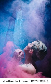 Woman In Shower With Colorful Steam