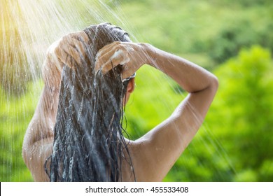 Woman Showering And Shampooing Outdoor