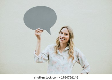 Woman showing a blank speech bubble