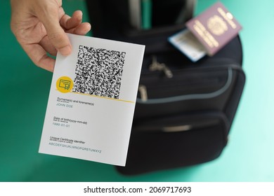 Woman Showing EU Covid Certificate With Quad Code. With Baggage.